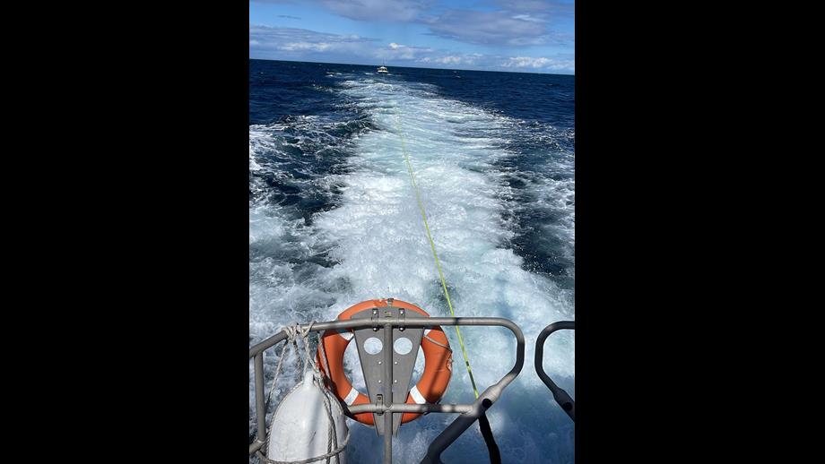 Eyemouth RNLI lifeboat tows fishing boat, the casualty vessel can be see behind the all-weather lifeboat.