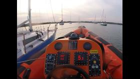 Lymington Lifeboat with yacht under tow