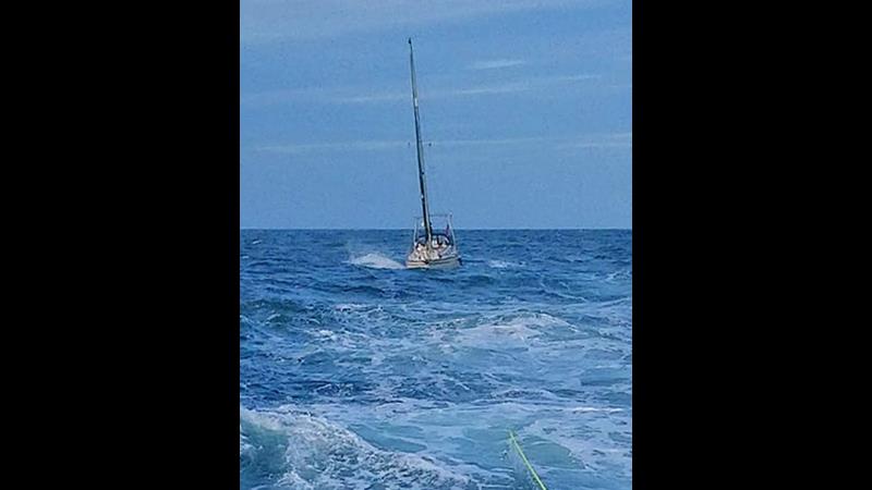 The stranded yacht being towed by Lowestoft RNLI Relief Lifeboat Eric's Legend