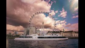 the Woods' Silver Fleet flagship river yacht Silver Sturgeon in front of the London Eye