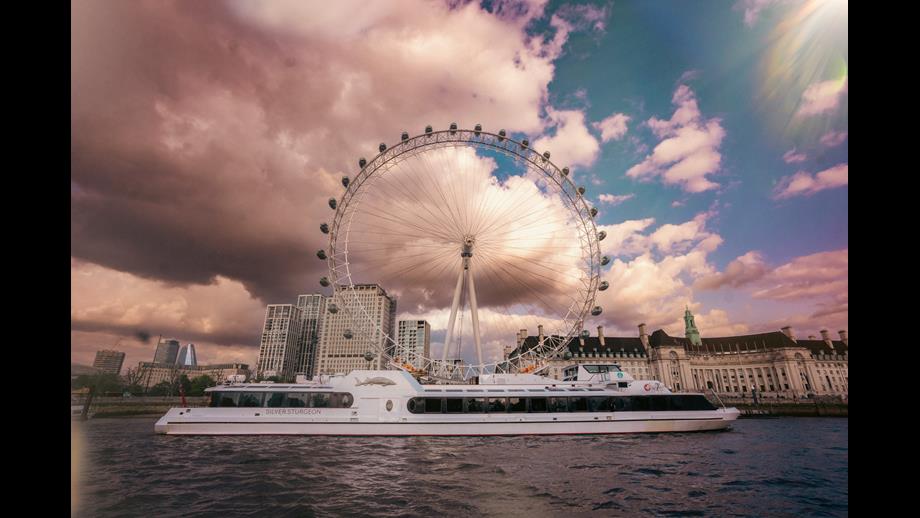 the Woods' Silver Fleet flagship river yacht Silver Sturgeon in front of the London Eye