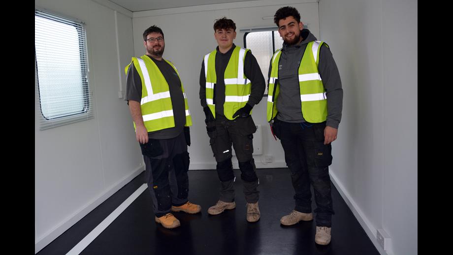 Gigawatt Electrical Services electricians Adam Bradbury-Smith, Reece Hall and Grayson Bennett. inside one of the two portable buildings