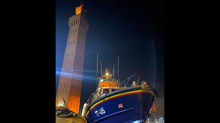 Humber RNLI's all-weather lifeboat (ALB), Severn-class Pride of the Humber, under Grimsby Dock tower at night