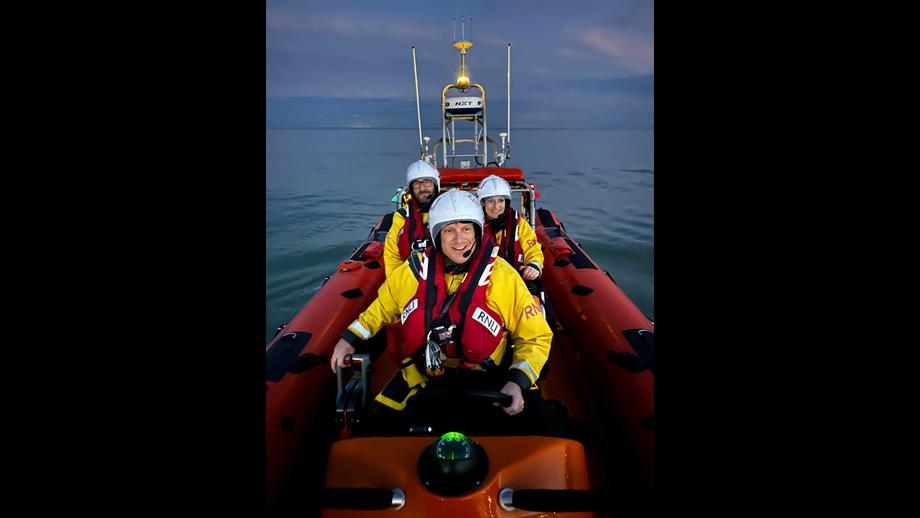 Night photo of the crew of the inshore lifeboat