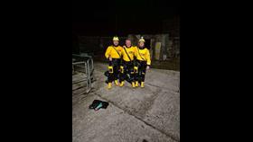 Crew members Aonghus O hIarnain, Declan Brannigan and Ronan MacGiollapharaic standing on Cill Einne Pier after rescuing the four dolphins