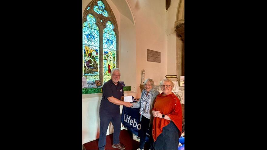 Simon Tibble receiving donation at Horstead church 