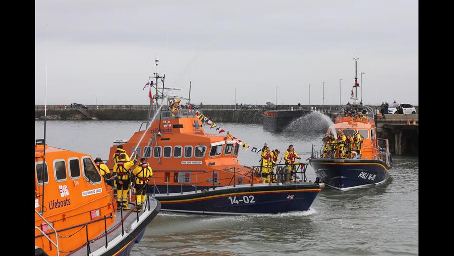 Two Tamars with waterspraying and a Trent passing through the water