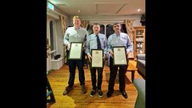 RNLI Helm Brendan Cottrell, Coxswain Aiden Bush, and crewmember Brian McSweeney with their RNLI awards