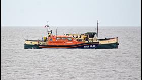 Lowestoft RNLI lifeboat alongside the former tug 