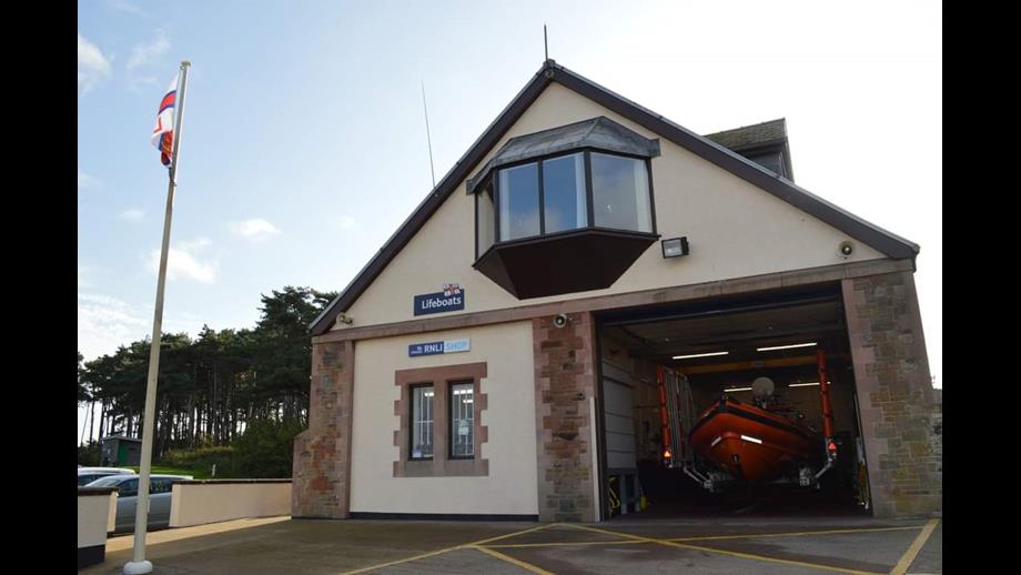 Orange lifeboat inside the building.
