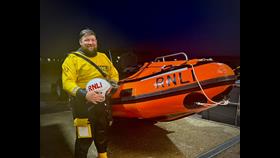 Ant Hole standing next to Calshot RNLI's D Class Lifeboat 'David Radcliffe'
