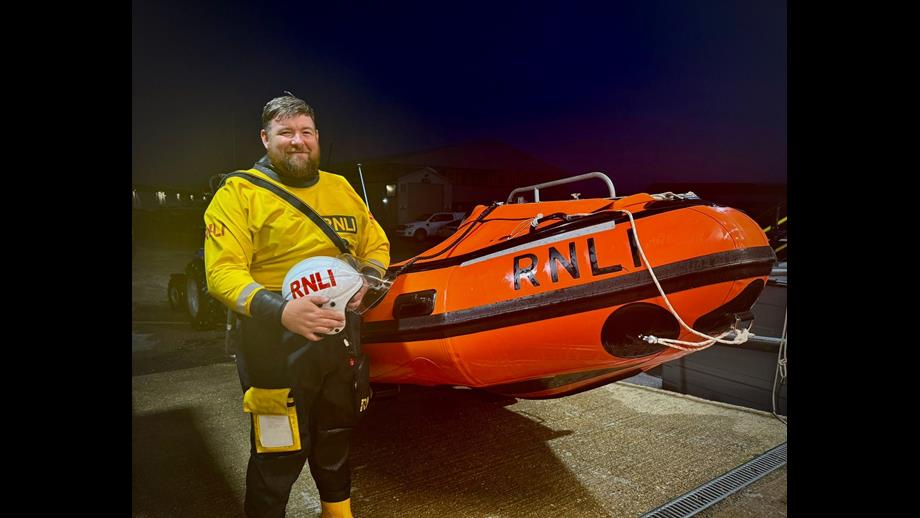 Ant Hole standing next to Calshot RNLI's D Class Lifeboat 'David Radcliffe'