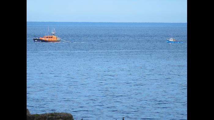 Seahouses Lifeboat towing the casualty vessel