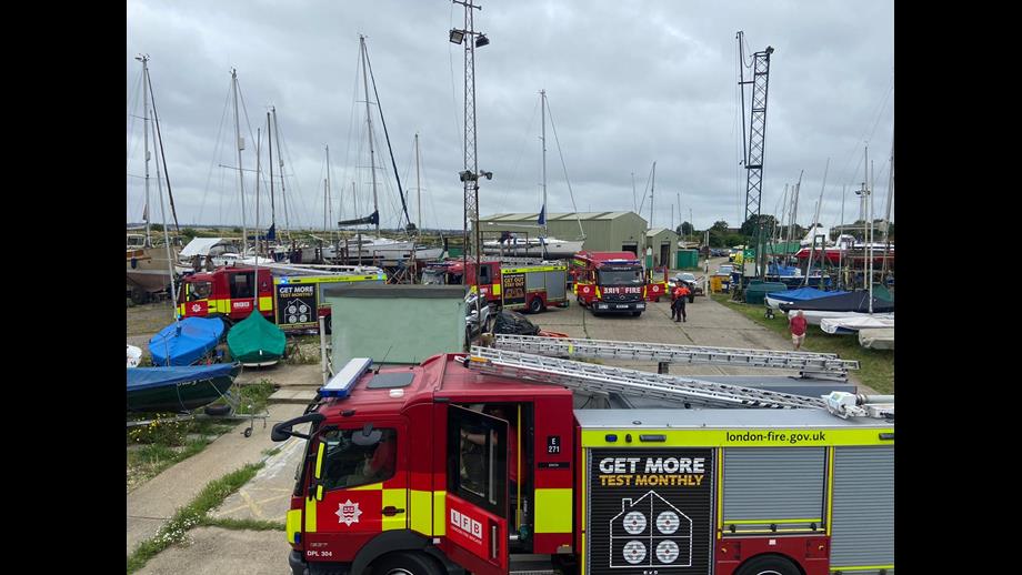 Fire trucks amongst vessels at yacht club
