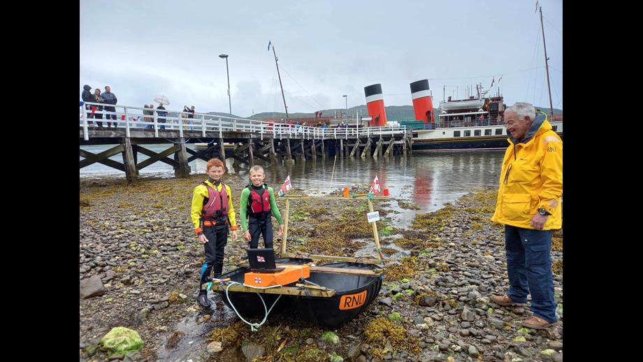 Junior raft race winners with their craft, and the PS Waverley in the background