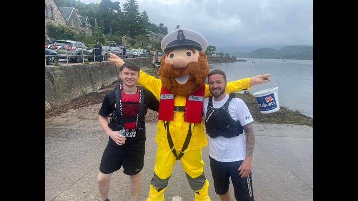 RNLI raft race crew and the fundraising mascot Stormy Stan