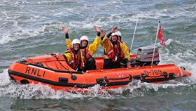 Littlehampton RNLI's volunteer crew wave to the crowds on Ray of Hope