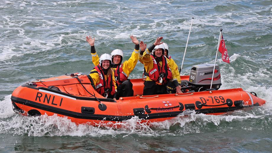 Littlehampton RNLI's volunteer crew wave to the crowds on Ray of Hope