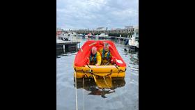 Treasurer/Crew John Tait and Deputy Coxwain Alan Jeans as the 1st to enter the raft