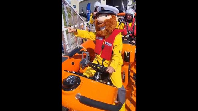 Stormy Stan the RNLI mascot at the Helm of St Bees Inshore Lifeboat directing the launch