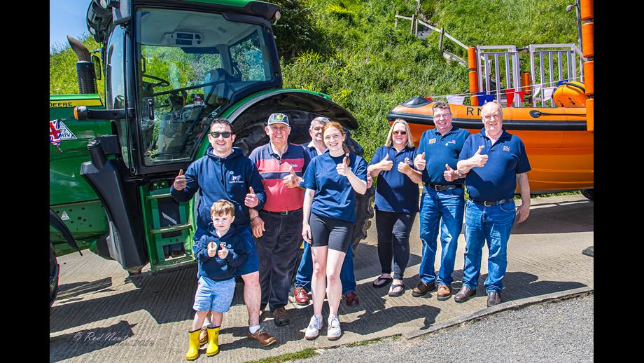 Four year old Henry Binsley with signatories and escorting drivers. Leading tractor and Lifeboat behind.