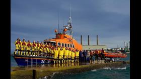 Larne RNLI volunteers pictured alongside their lifeboats