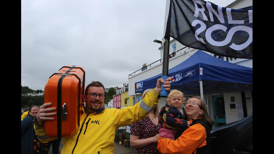 Tobermory RNLI Coxswain David McHaffie celebrates the signing of the RNLI 200 Scroll
