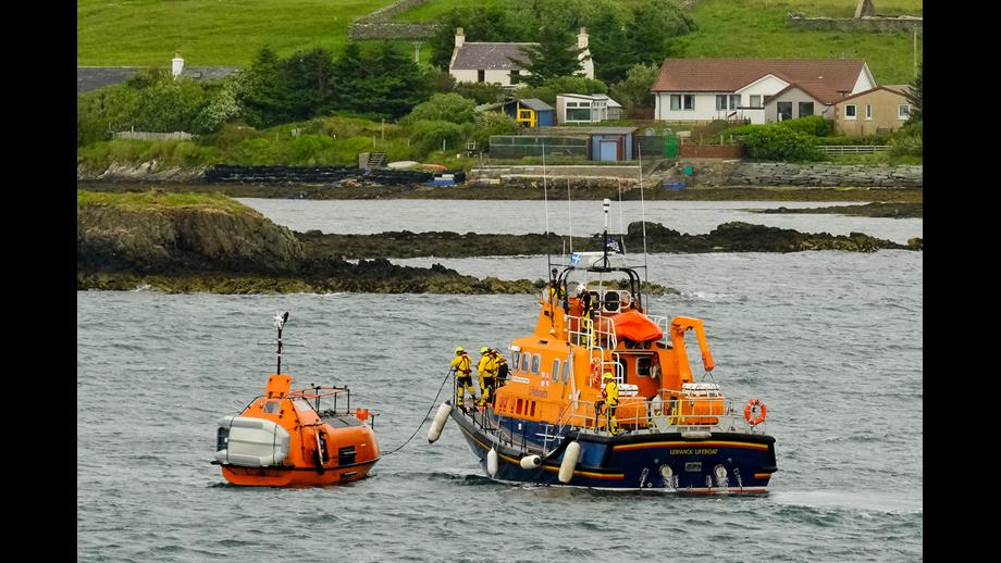 After the two-hour tow, Lerwick Lifeboat crew bring the former offshore lifeboat alongside, with Bressay Marine in the distance.