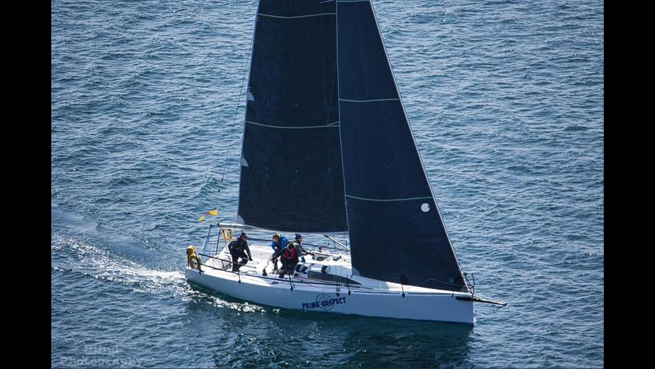 Prime Suspect flying under the RNLI burgee for Round Ireland race