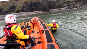 Skerries RNLI Volunteers making their way ashore to assist the man