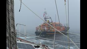 Eyemouth lifeboat 'Helen hastings' tows yacht 'Flamingo' after engine failure. The weather is heavy fog with a moderate swell.