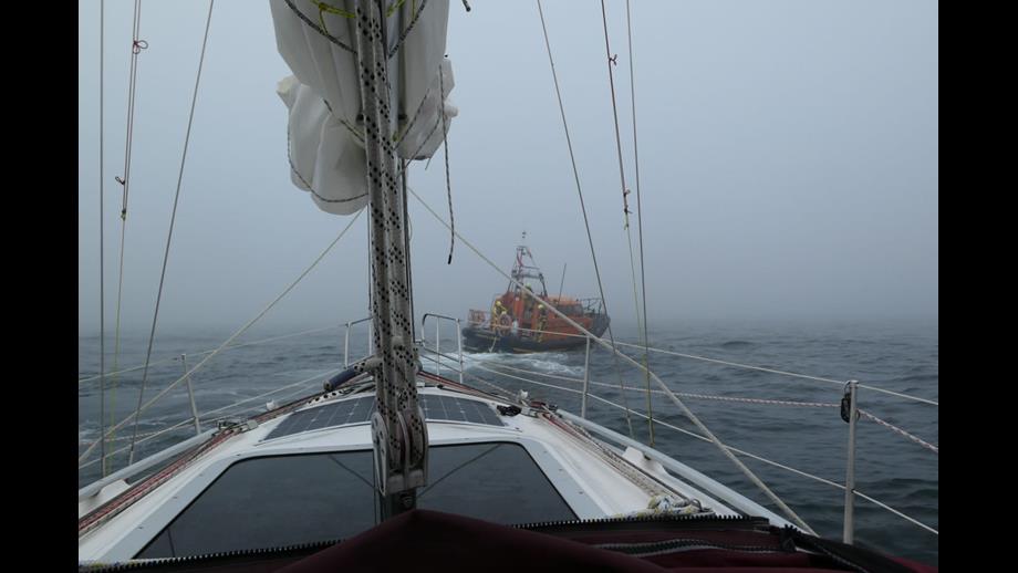 Eyemouth lifeboat 'Helen hastings' tows yacht 'Flamingo' after engine failure. The weather is heavy fog with a moderate swell.