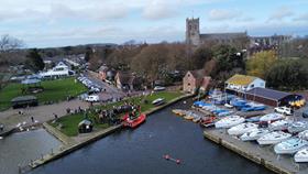 Aerial photo of crowd standing on the green at Christchurch Quay next to an Atlantic 85 lifeboat