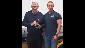 George Craig with 20 year service RNLI medal, stood with Stonehaven RNLI LOM Andy Martin