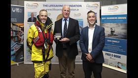 RNLI Trustee and Coxswain Paddy McLaughlin receives the Ireland medal with Dunmore East RNLI volunteer Peter Grogan and Head of Water Safety Gareth Morrison