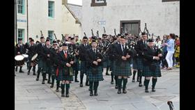 Pipe band marching towards the camera