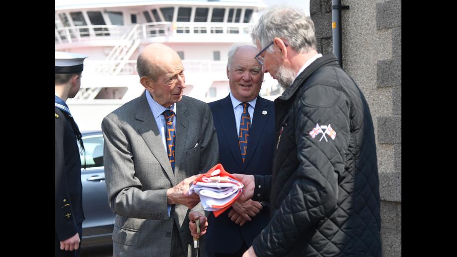 The Duke of Kent presenting the very first of the RNLI's new House Flag to Fraserburgh RNLI, marking the new patronage of the charity by His Majesty King Charles.