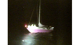 The yacht Pink Delta with two Padstow RNLI crew aboard assisting the skipper