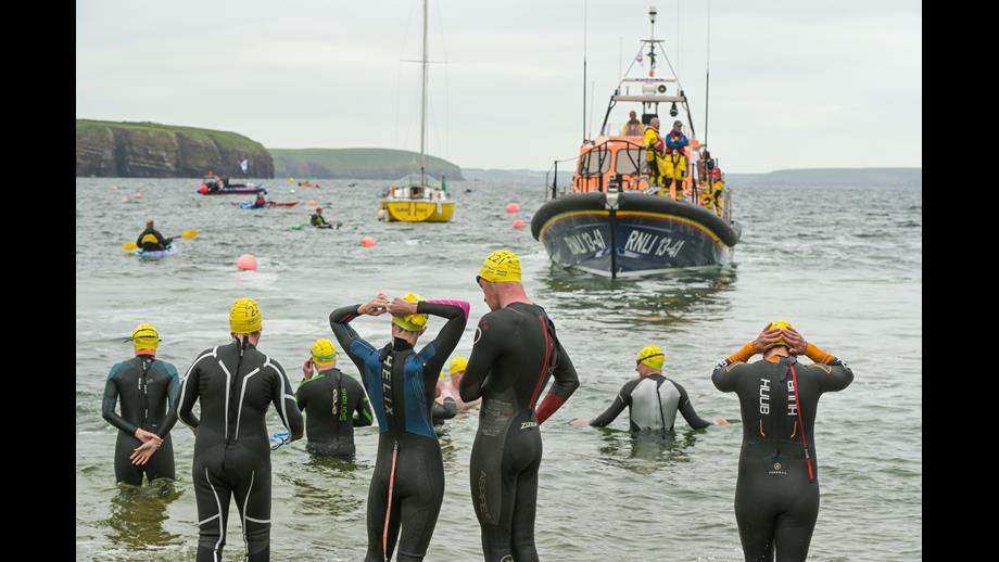 Swimmers prepare for action with Dunmore East RNLI All Weather Lifeboat in the background