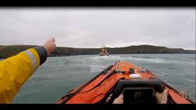 Fishguard lifeboats approaching the location of the beach on which the camp had been set up.
