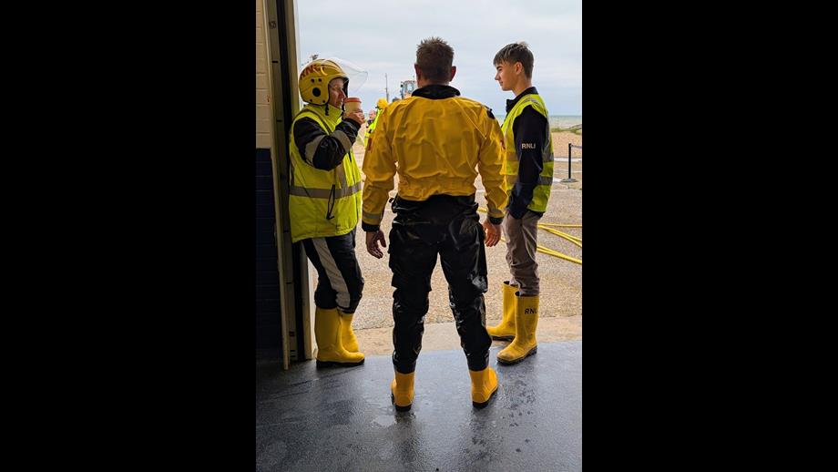 Three RNLI volunteers relaxing after a trip afloat 