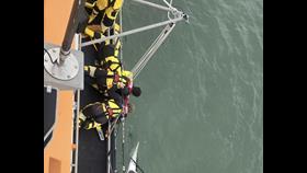 Yarmouth RNLI crew working together during rescue