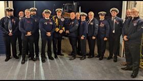 A group of RNLI volunteers with Lord Warden Admiral Sir George Zambellas and The Right Worshipful the Mayor of New Romney CllrJohn Rivers after receiving their King's Coronation Medals