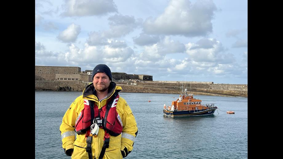 Newly fledged Coxswain - Saul Woodruff with Inner Wheel II in the background