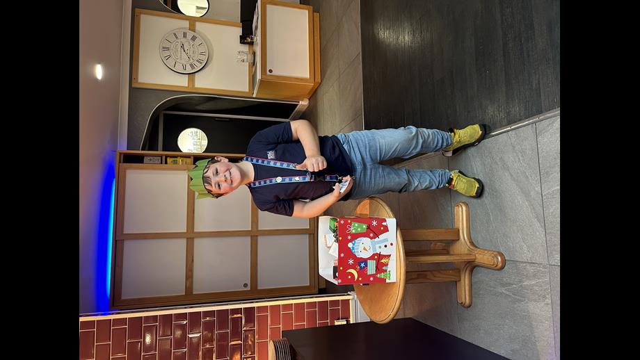 Daniel helping with the lucky dip draw at Christmas Lunch