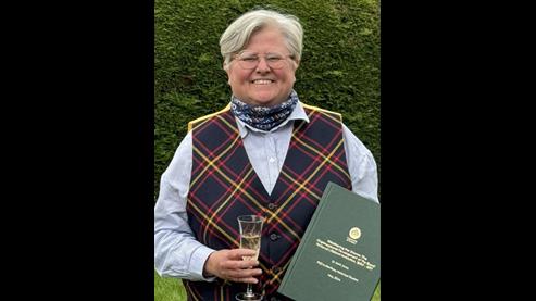 Sam with her PhD thesis shortly after passing her viva