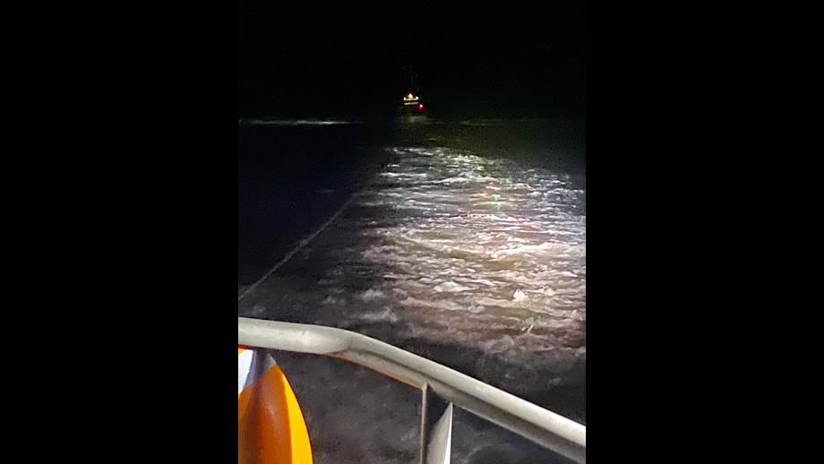Barry Dock lifeboat towing fishing boat at distance to safety away from the reef
