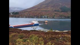 Cargo vessel aground in the Kylerhea narrows in Portree RNLB standing by.
