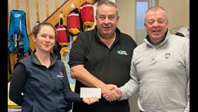 LISA HOLLINGHUM &amp; JOHN BERMINGHAM RECEIVE DONATION FROM MARK CORCORAN