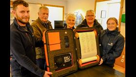 Signatories to the RNLI 200 Scroll (l to r) Stephen Manson, Coxswain; Hewitt Clark MBE, former Coxswain; Rhoda Watt, Treasurer of the Fundraising Committee; and John Webster, Branch Chairman. Also pictured - Charlotte Hill, of the RNLI's Bicentenary Team.
